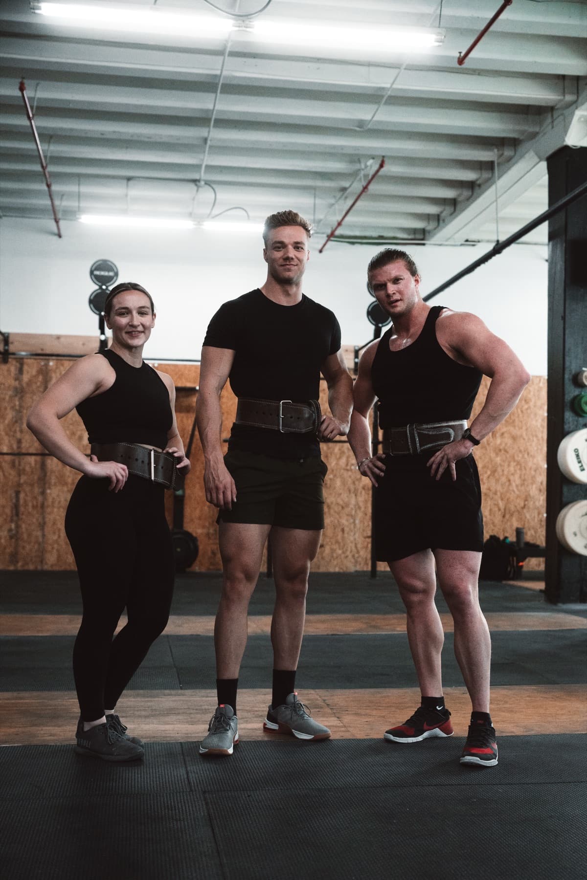 Three RepWerks lifters standing in a gym