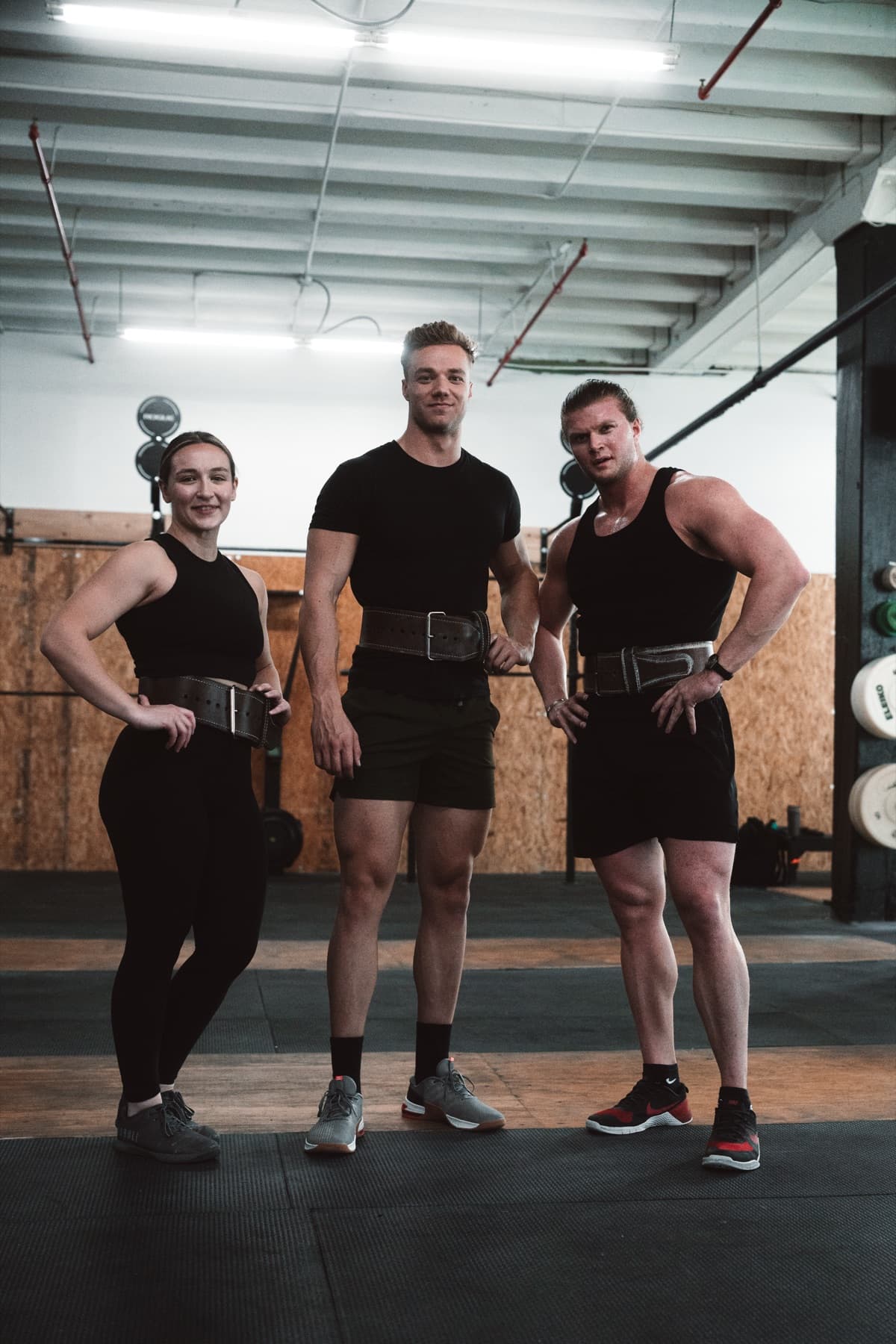 Three Repwerks lifters standing in a gym